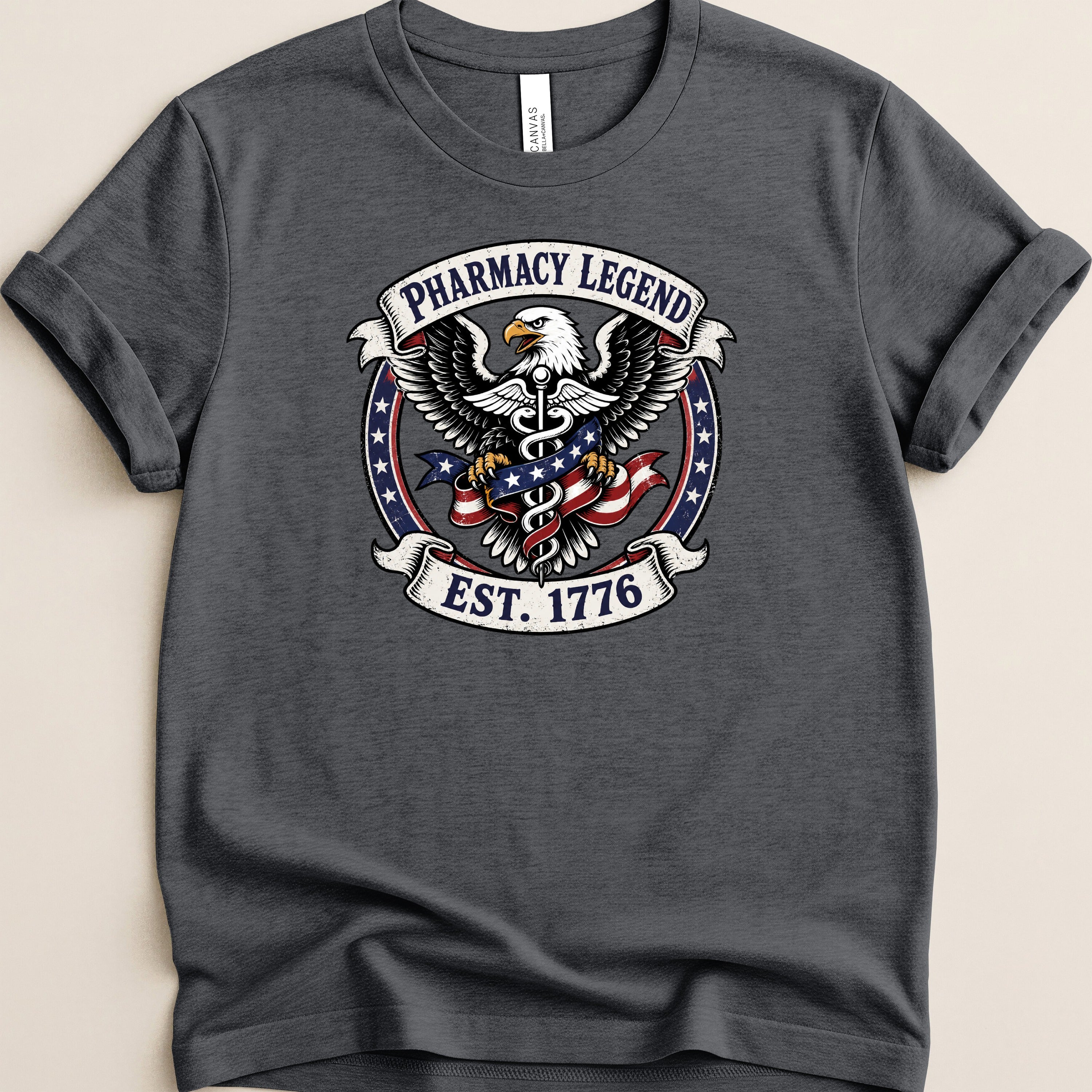 Pharmacy Legend EST. 1776 eagle and American flag graphic on dark grey t-shirt.