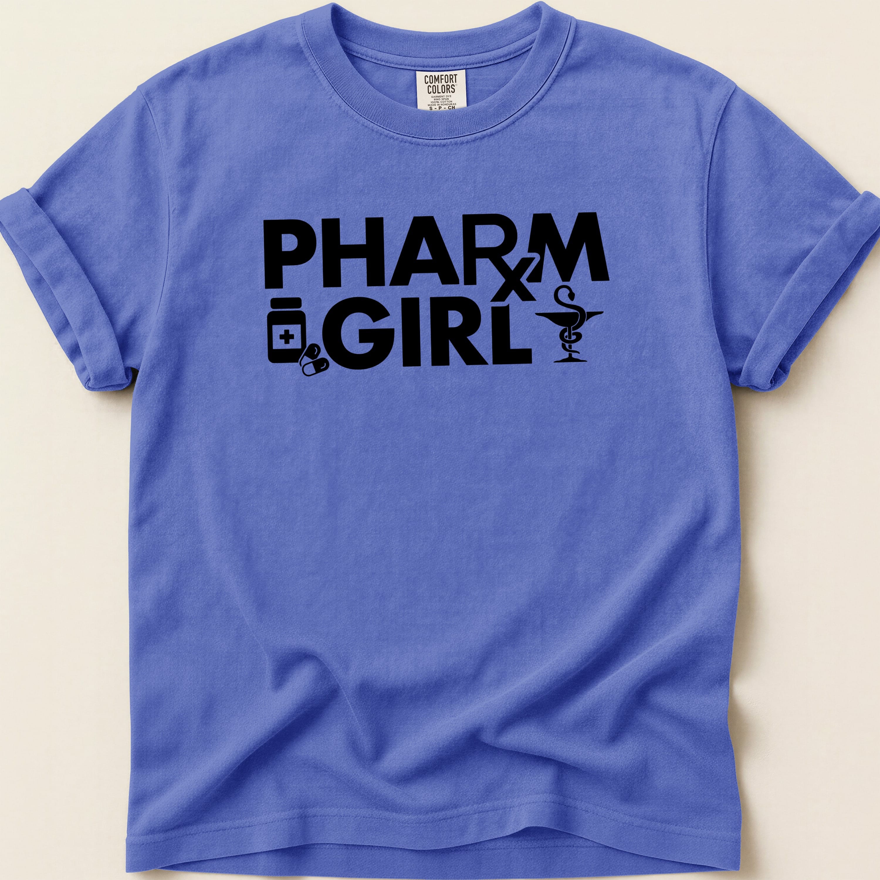 Purple t-shirt with "PHARM GIRL" text and medical icons.