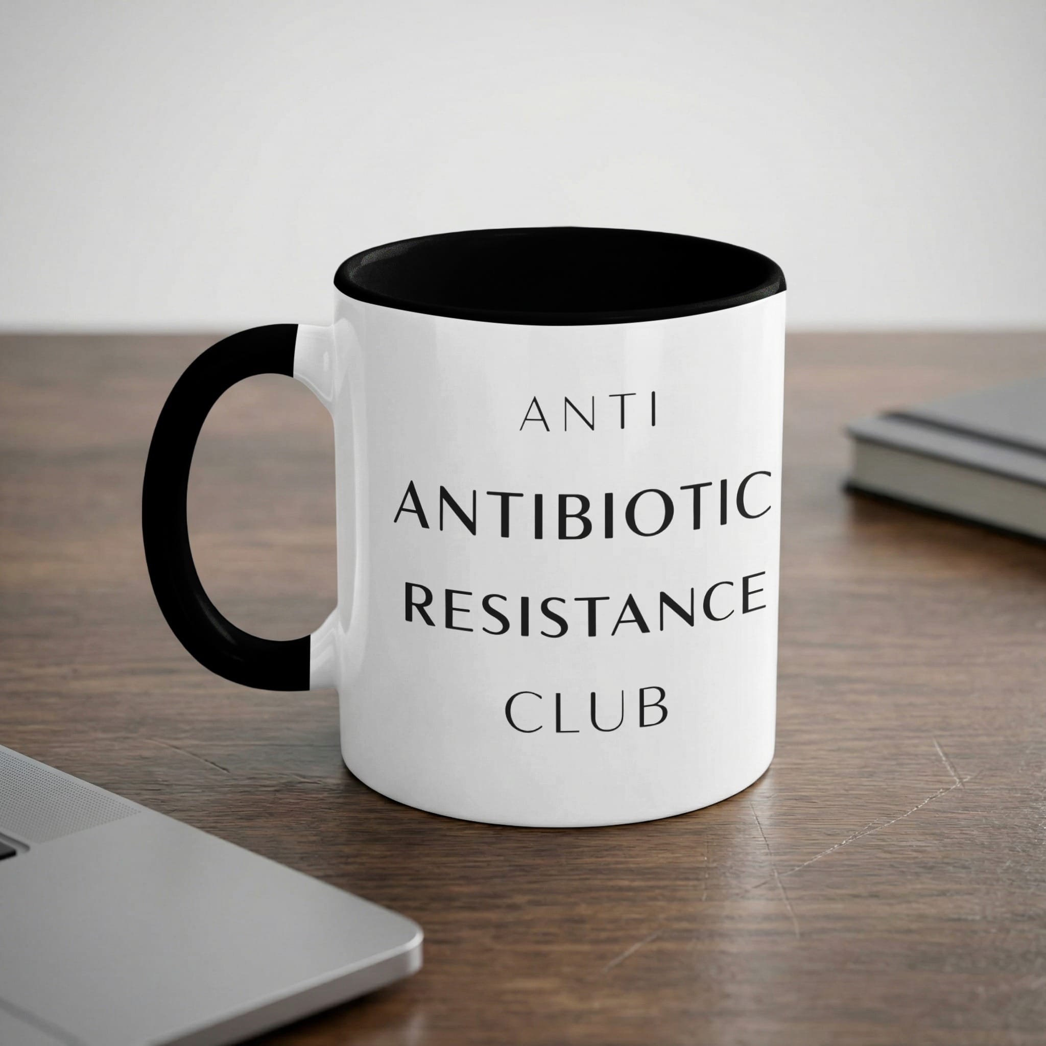 Black and white mug with "ANTI ANTIBIOTIC RESISTANCE CLUB" text.