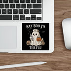 Cartoon ghost in nurse's cap holding syringe and pumpkin, saying "SAY BOO TO THE FLU".