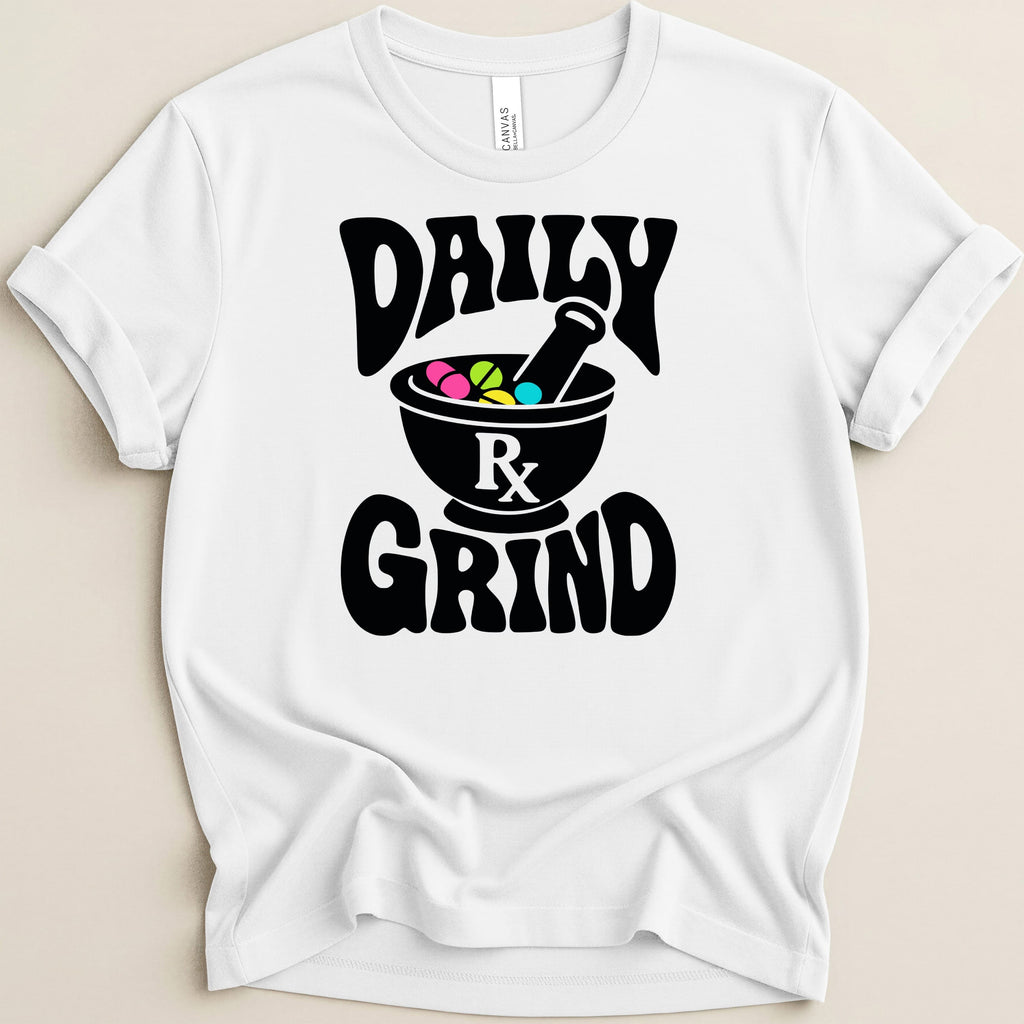 White t-shirt with "DAILY GRIND" text and a mortar and pestle with pills.