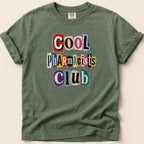 T-shirt with "COOL Pharmacists CLUB" in ransom-note lettering.