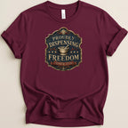 Maroon t-shirt with a "Proudly Dispensing Freedom Since 1776" emblem.