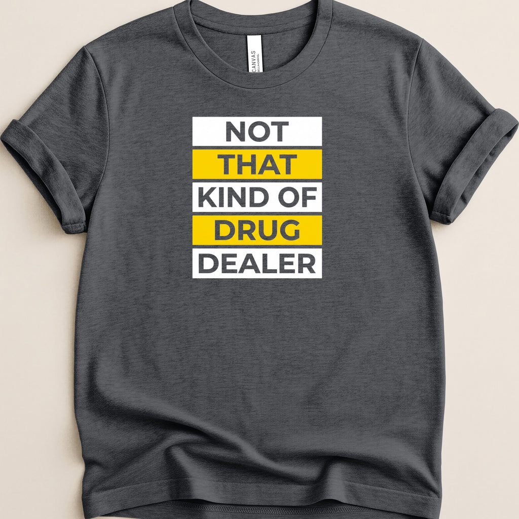 Dark t-shirt with bold white and yellow text reading "NOT THAT KIND OF DRUG DEALER".