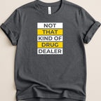 Dark t-shirt with bold white and yellow text reading "NOT THAT KIND OF DRUG DEALER".