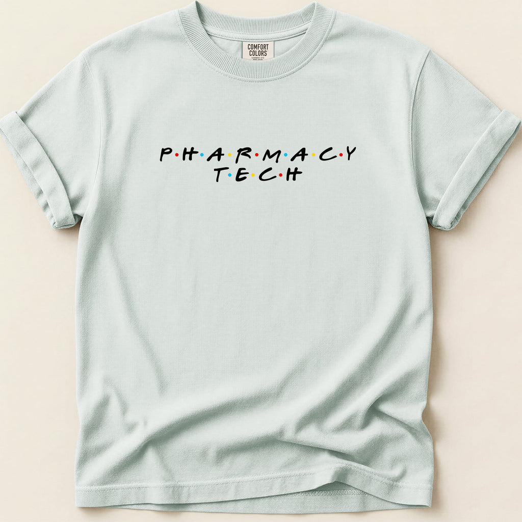 Light blue t-shirt with "PHARMACY TECH" in colorful, spaced-out letters.