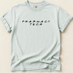 Light blue t-shirt with "PHARMACY TECH" in colorful, spaced-out letters.