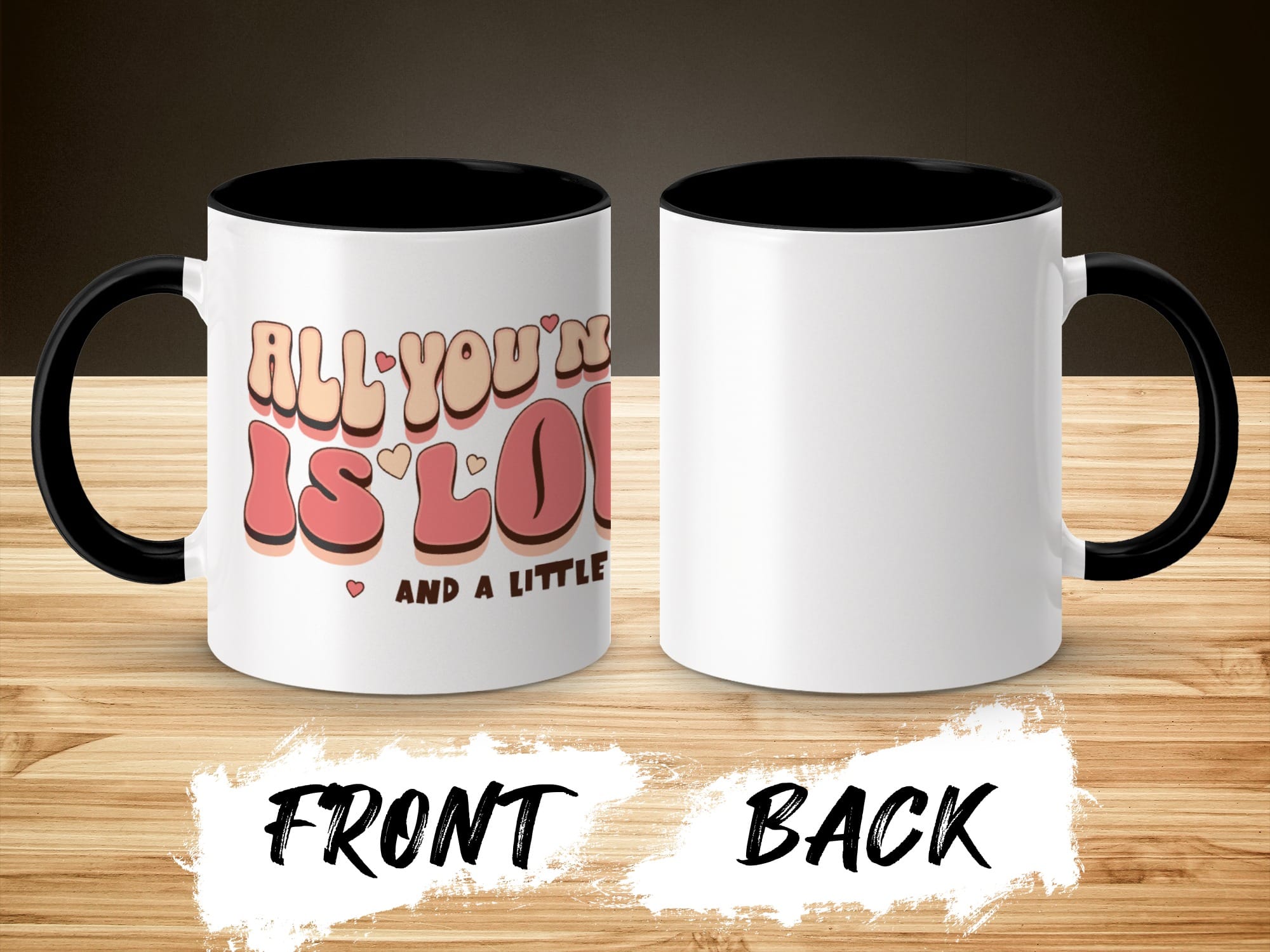 White mug with "All you need is love and a little..." text, black interior and handle.