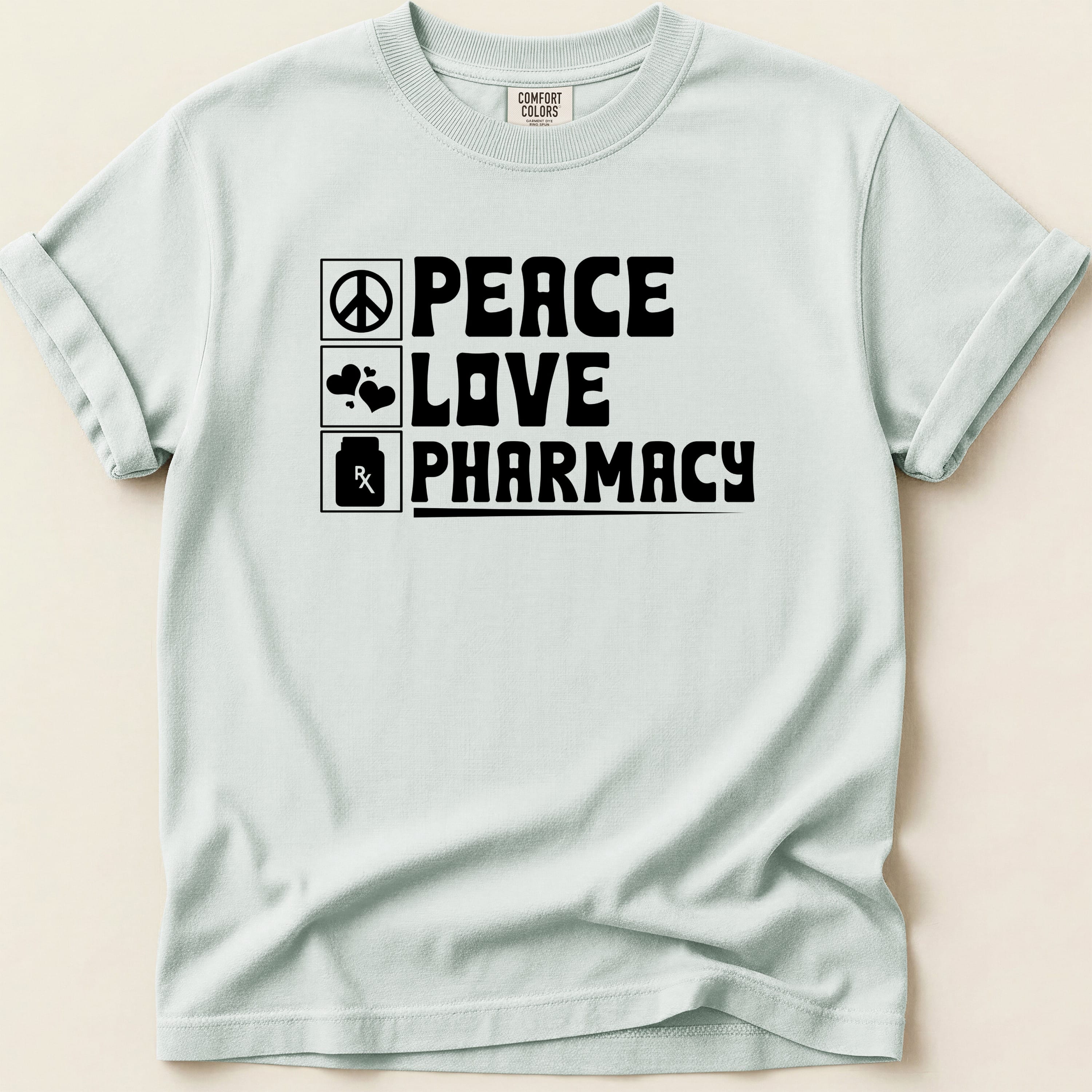 Light blue t-shirt with "Peace Love Pharmacy" and a pill bottle icon.