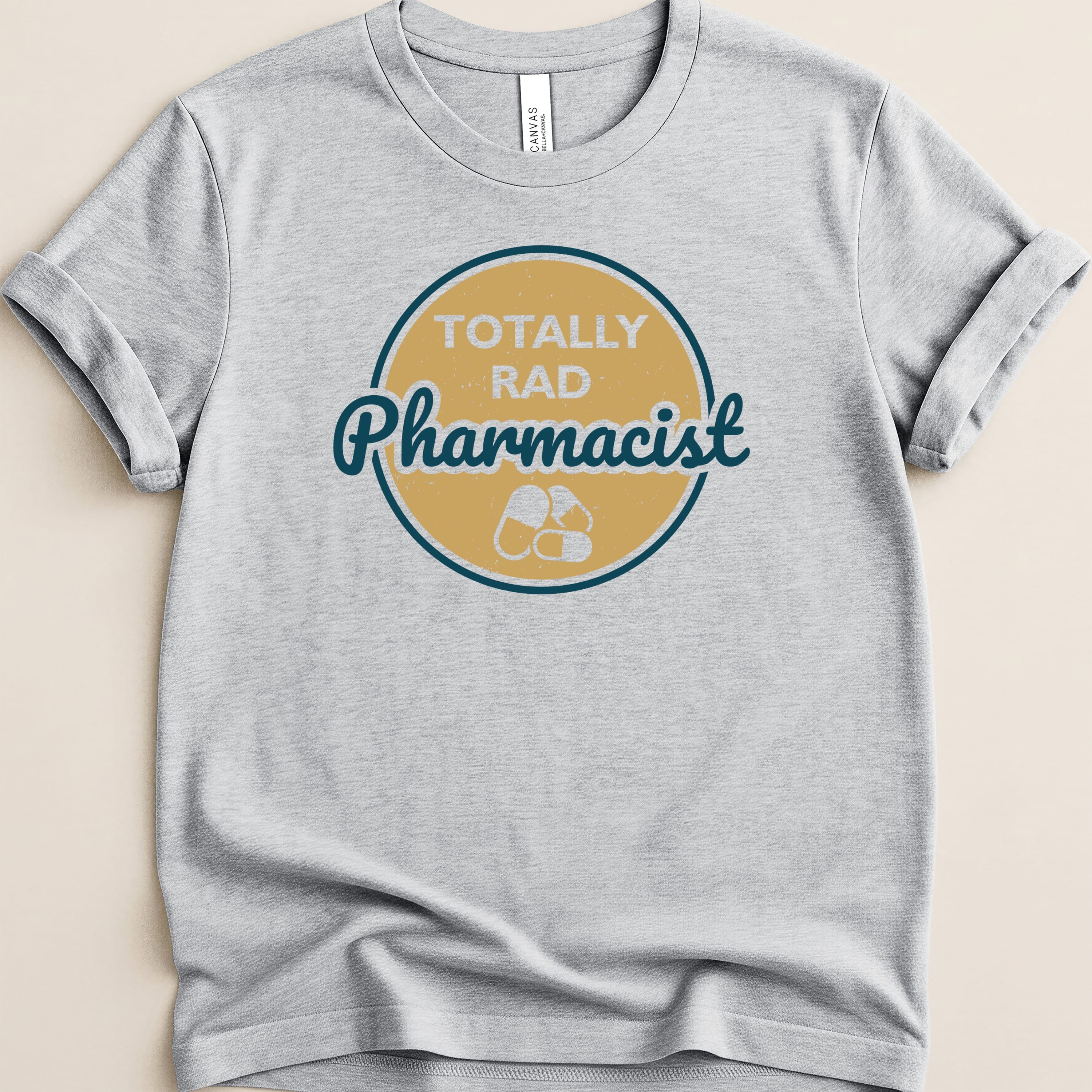 Gray t-shirt with "TOTALLY RAD Pharmacist" text and pill graphic.