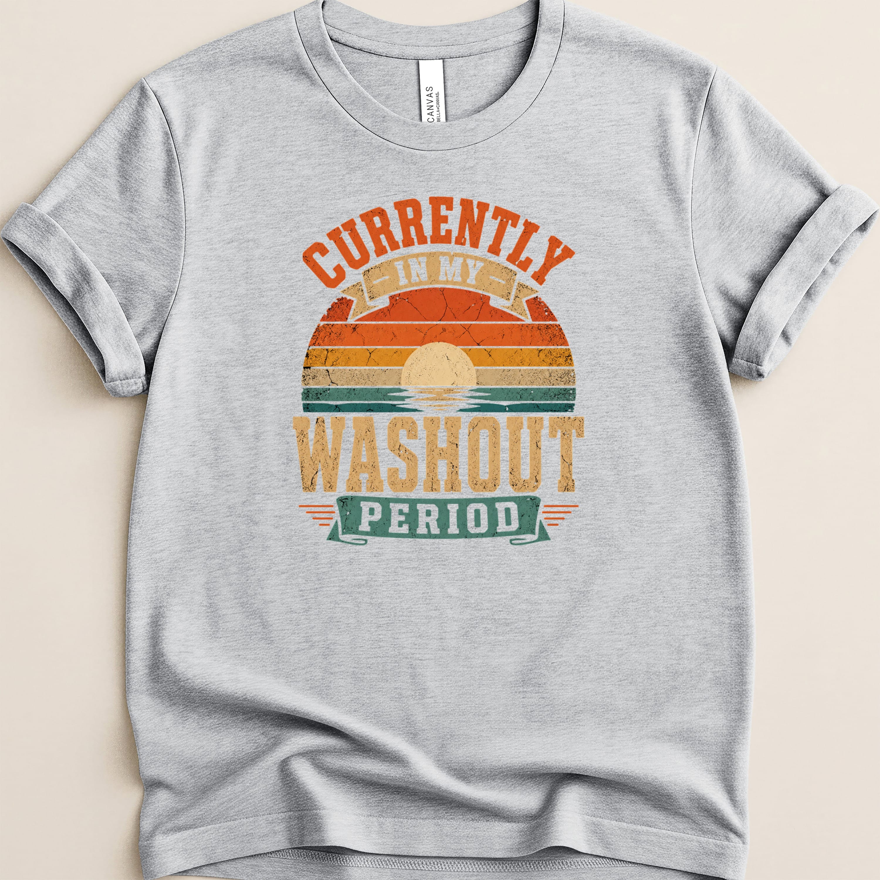 Grey t-shirt with "Currently in my washout period" text and retro sunset graphic.