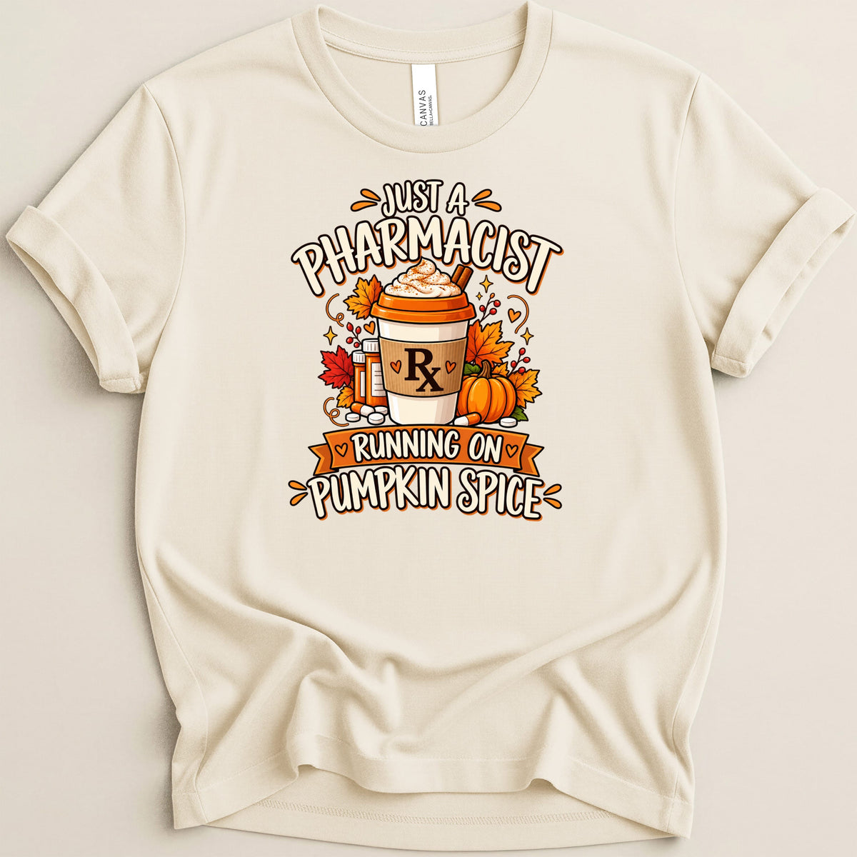 Cream t-shirt with "Just a Pharmacist Running on Pumpkin Spice" text and graphics.