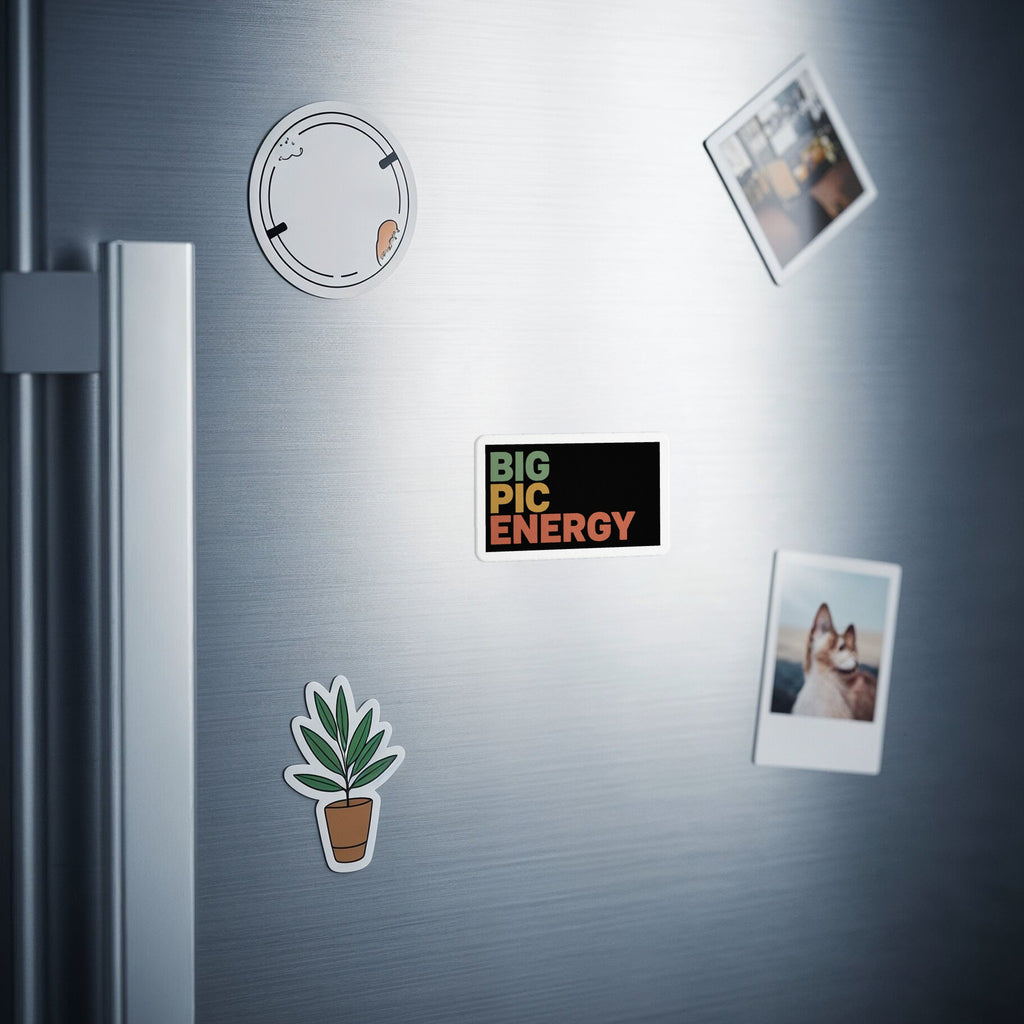 Rectangular magnet with "BIG PIC ENERGY" text on a refrigerator.