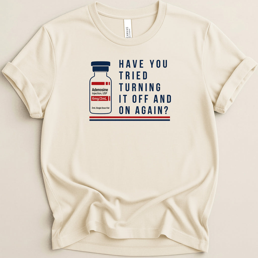 Cream t-shirt with image of Adenosine injection vial and text "Have You Tried Turning It Off and On Again?".
