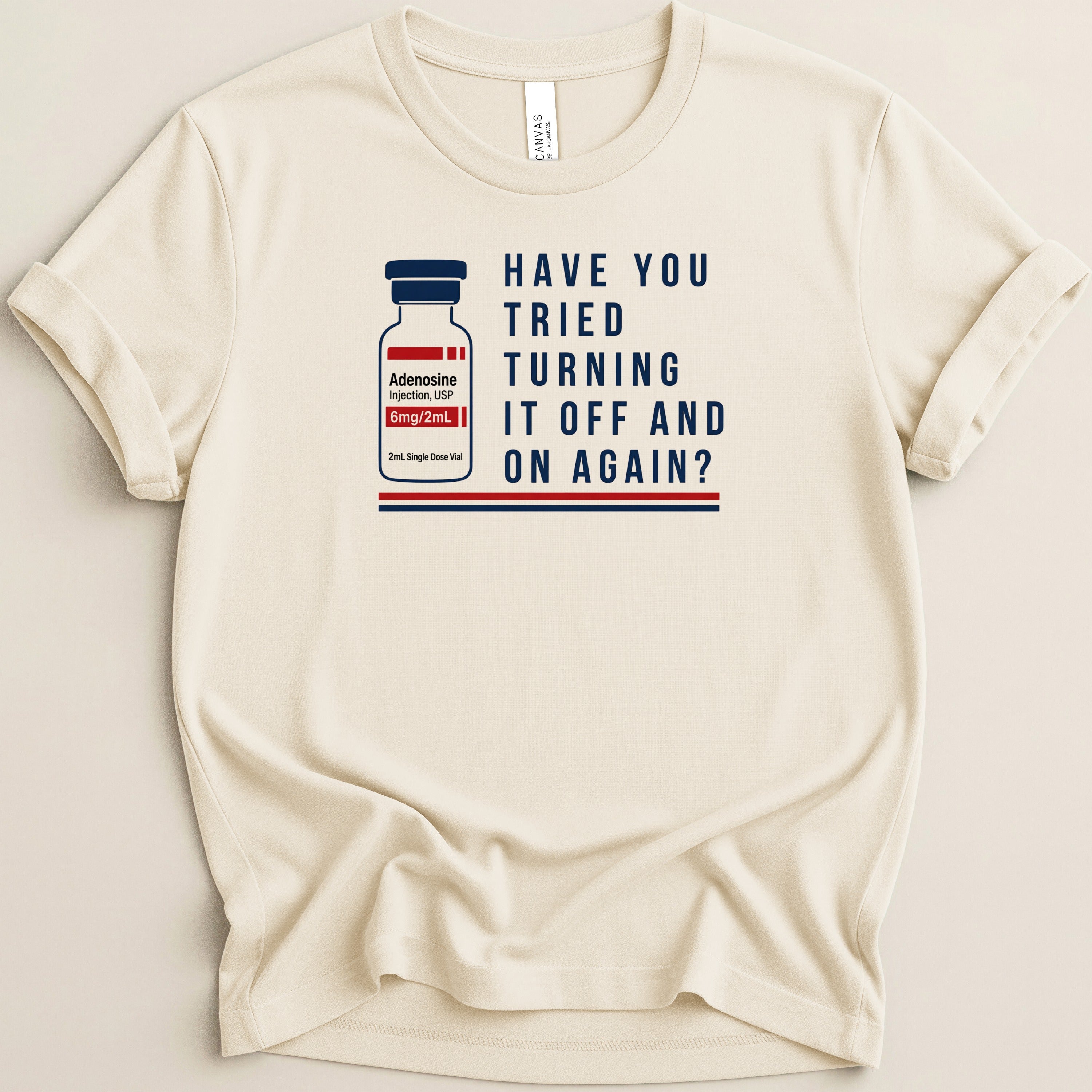 Cream t-shirt with image of Adenosine injection vial and text "Have You Tried Turning It Off and On Again?".