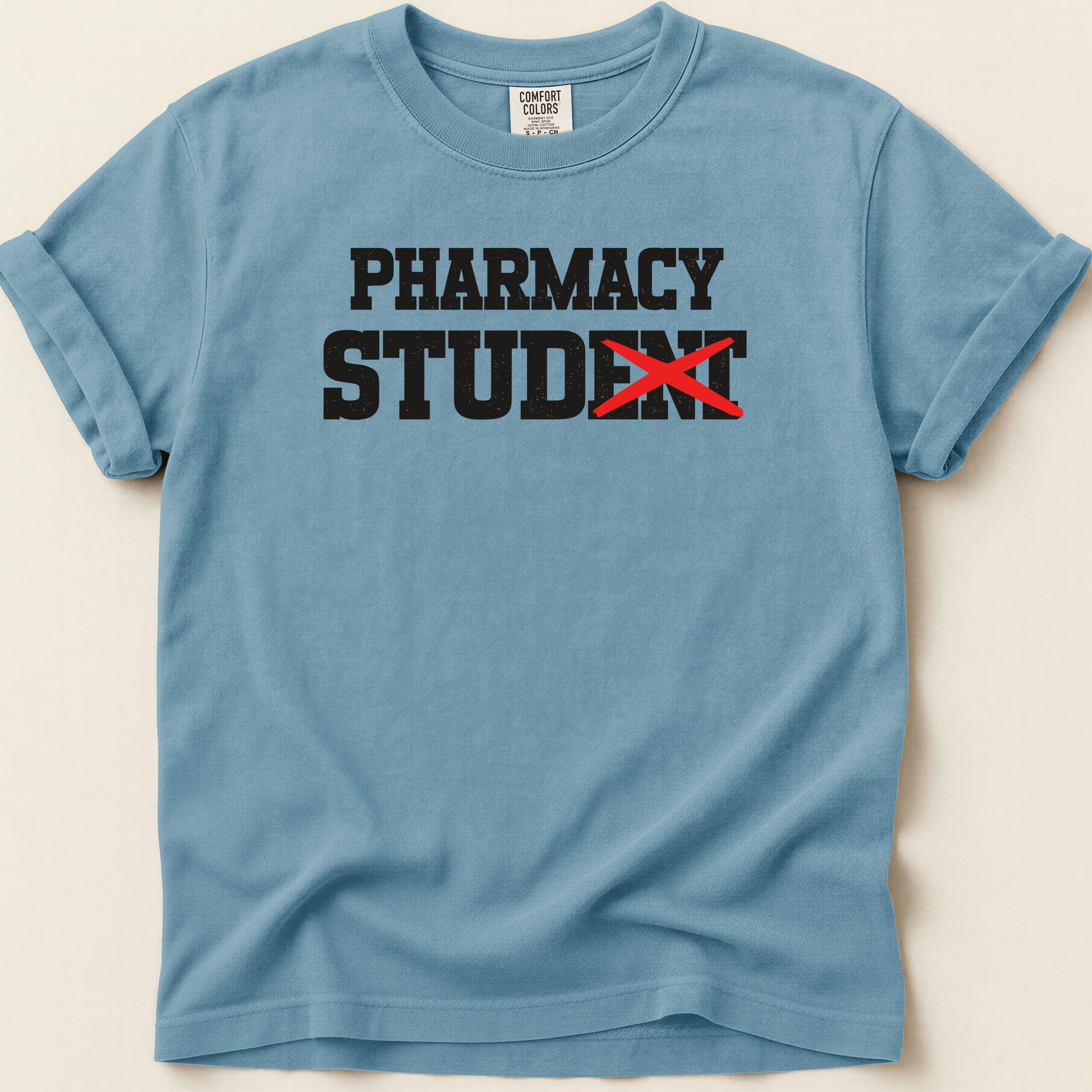 T-shirt with "PHARMACY STUDENT" text, red X over "ENT".