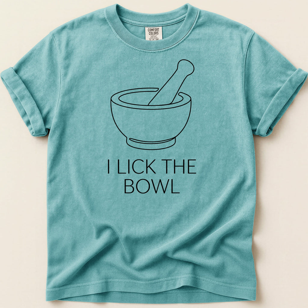 Teal t-shirt with a mortar and pestle graphic and text "I LICK THE BOWL".