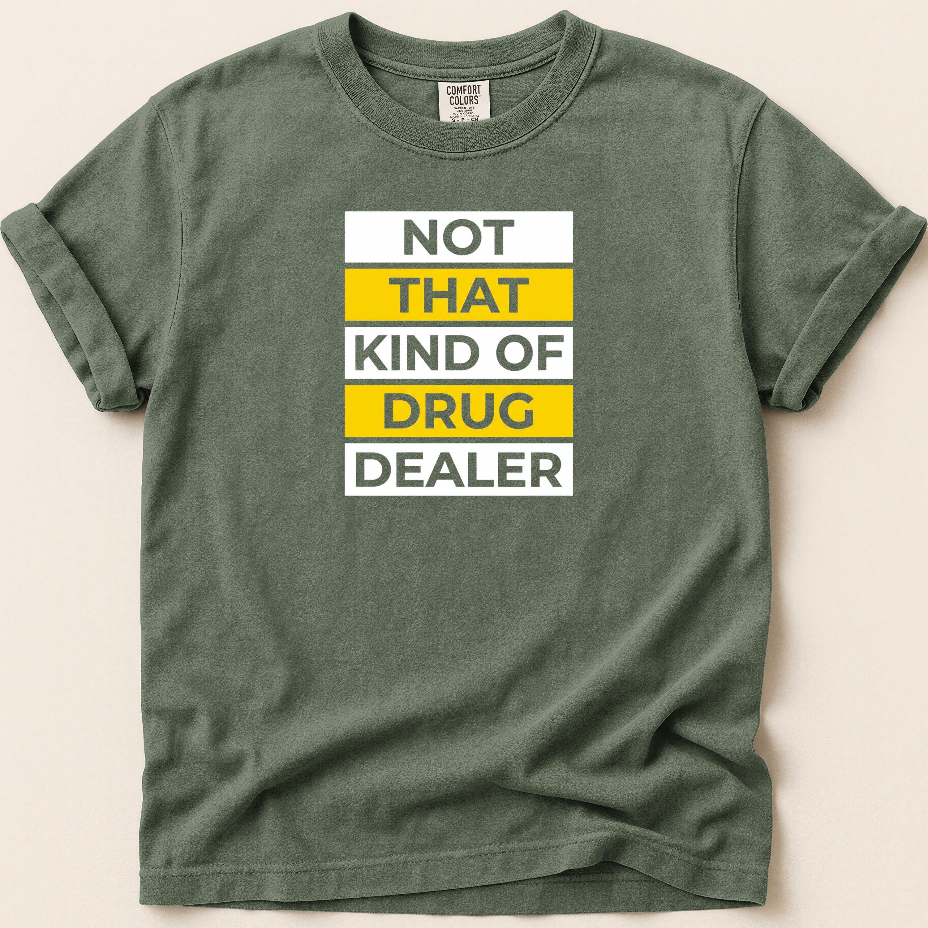 Green t-shirt with "NOT THAT KIND OF DRUG DEALER" text in white and yellow.