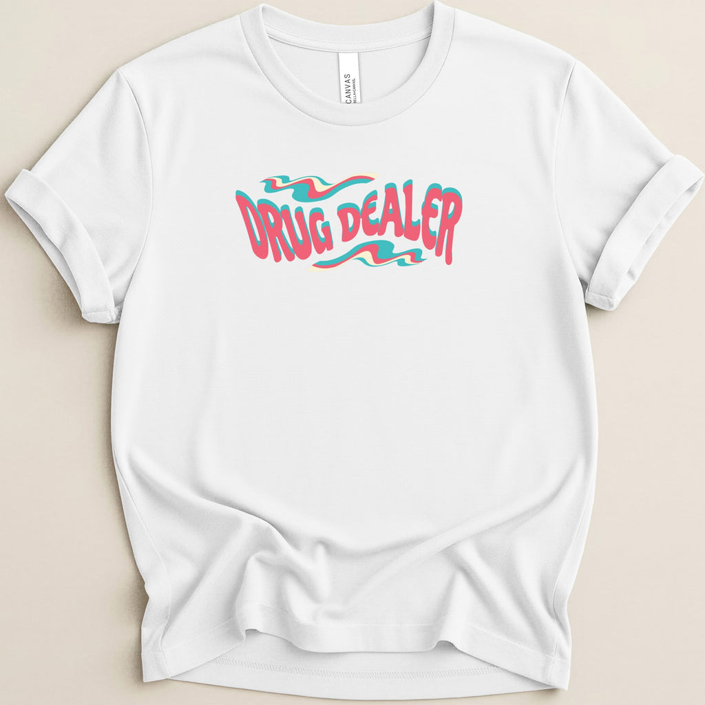 White t-shirt with "DRUG DEALER" text in wavy pink and blue lettering.