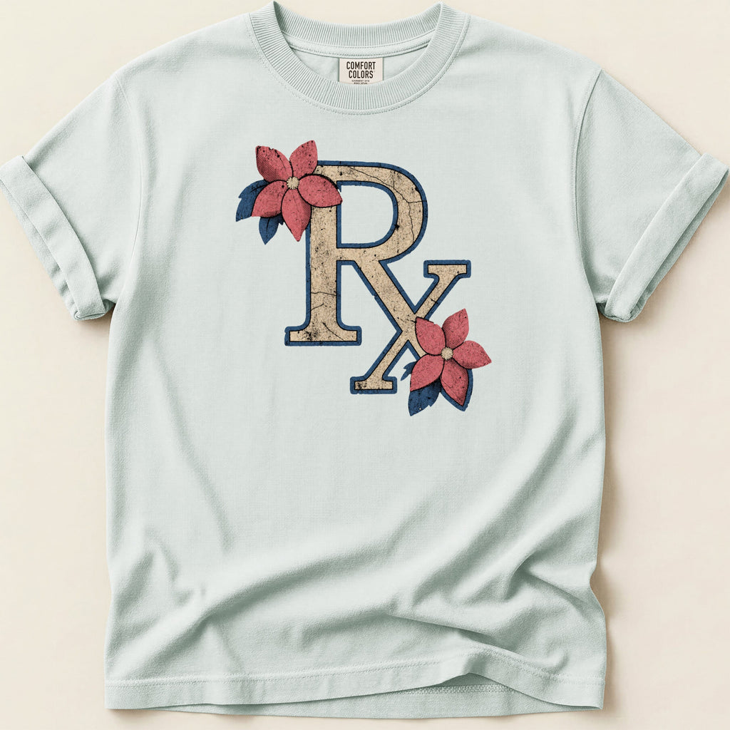 Light blue Comfort Colors t-shirt with distressed RX symbol and pink flowers.
