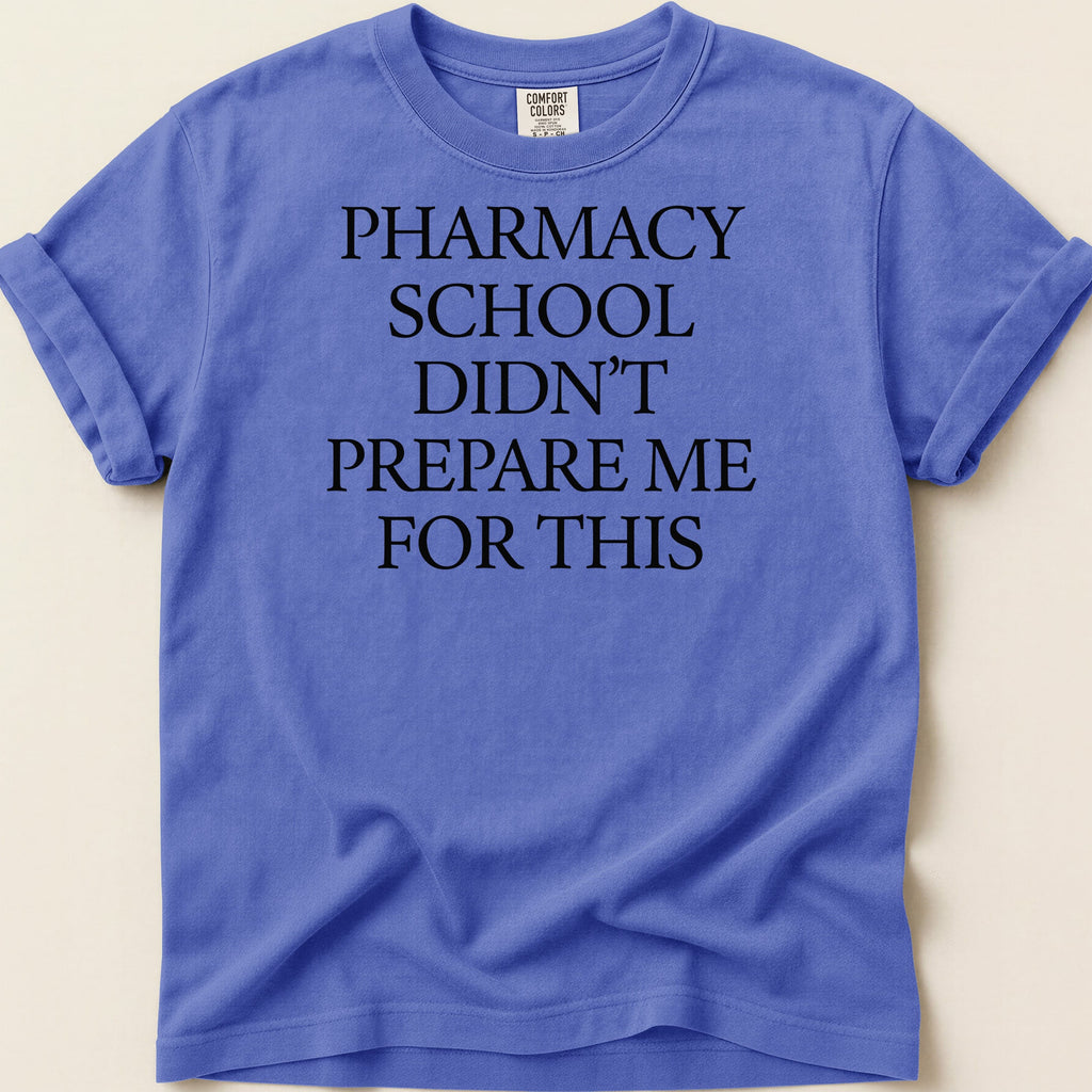 Purple t-shirt with black text: Pharmacy School Didn't Prepare Me For This.