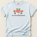 Light blue t-shirt features a cartoon crab in a lab coat with glasses and text 'Yes, I'm the crabby pharmacist.'