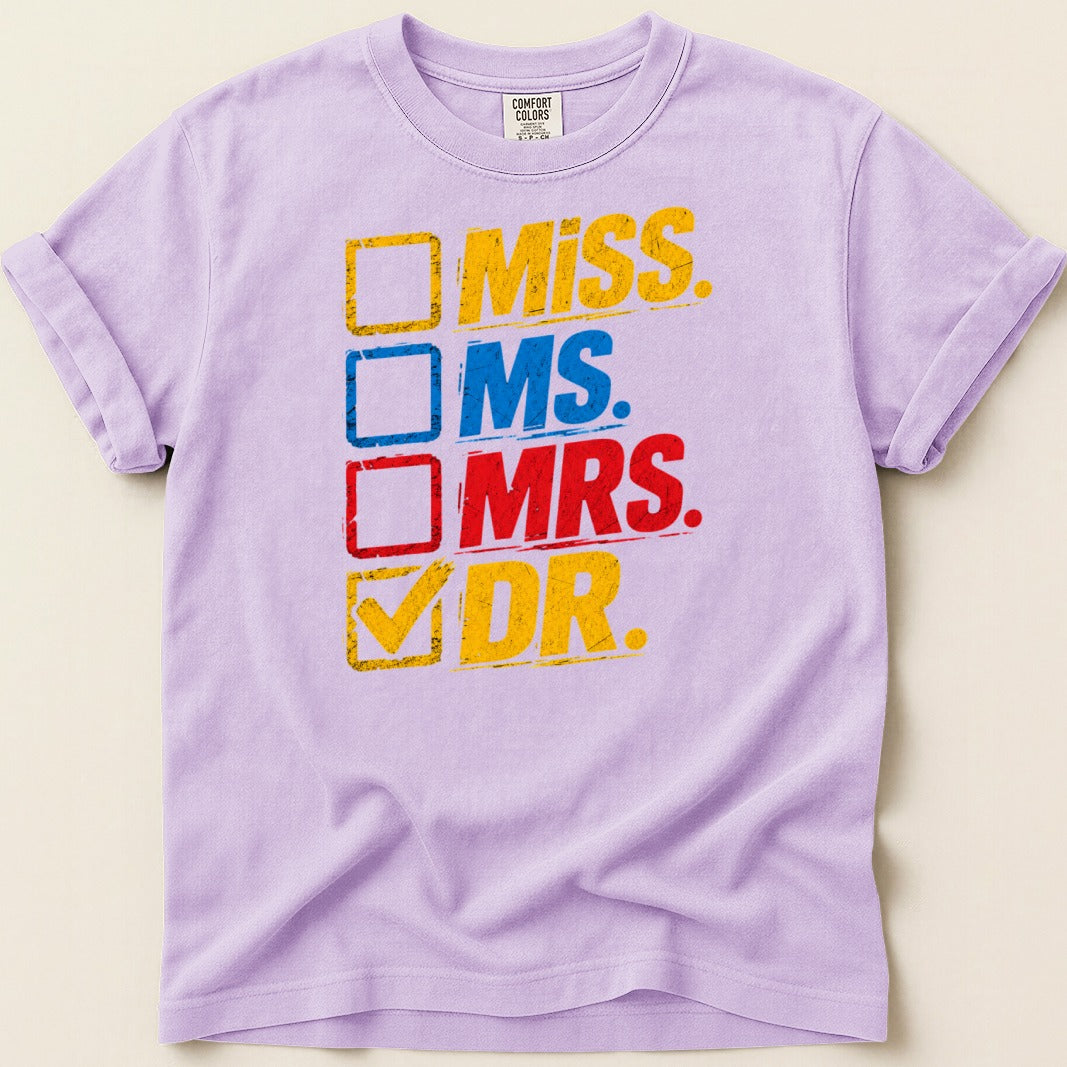 Purple t-shirt with "Miss", "Ms.", "Mrs.", and "Dr." text boxes, with a checkmark by "Dr."