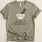 Gray t-shirt with graphic of a mortar and pestle saying "Crush it like you mean it."