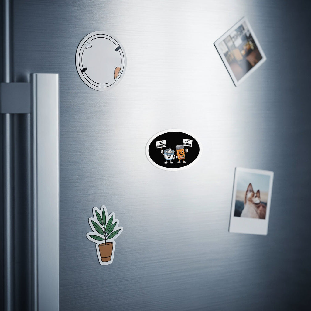 Two cartoon characters, "Probiotics" and "Antibiotics," on oval magnets on a refrigerator door.
