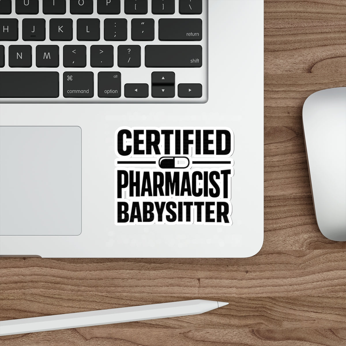 Certified Pharmacist Babysitter sticker on a laptop keyboard.
