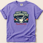 Purple t-shirt with "Trust Your Pharmacist" and "Dose of Care, Daily" text.