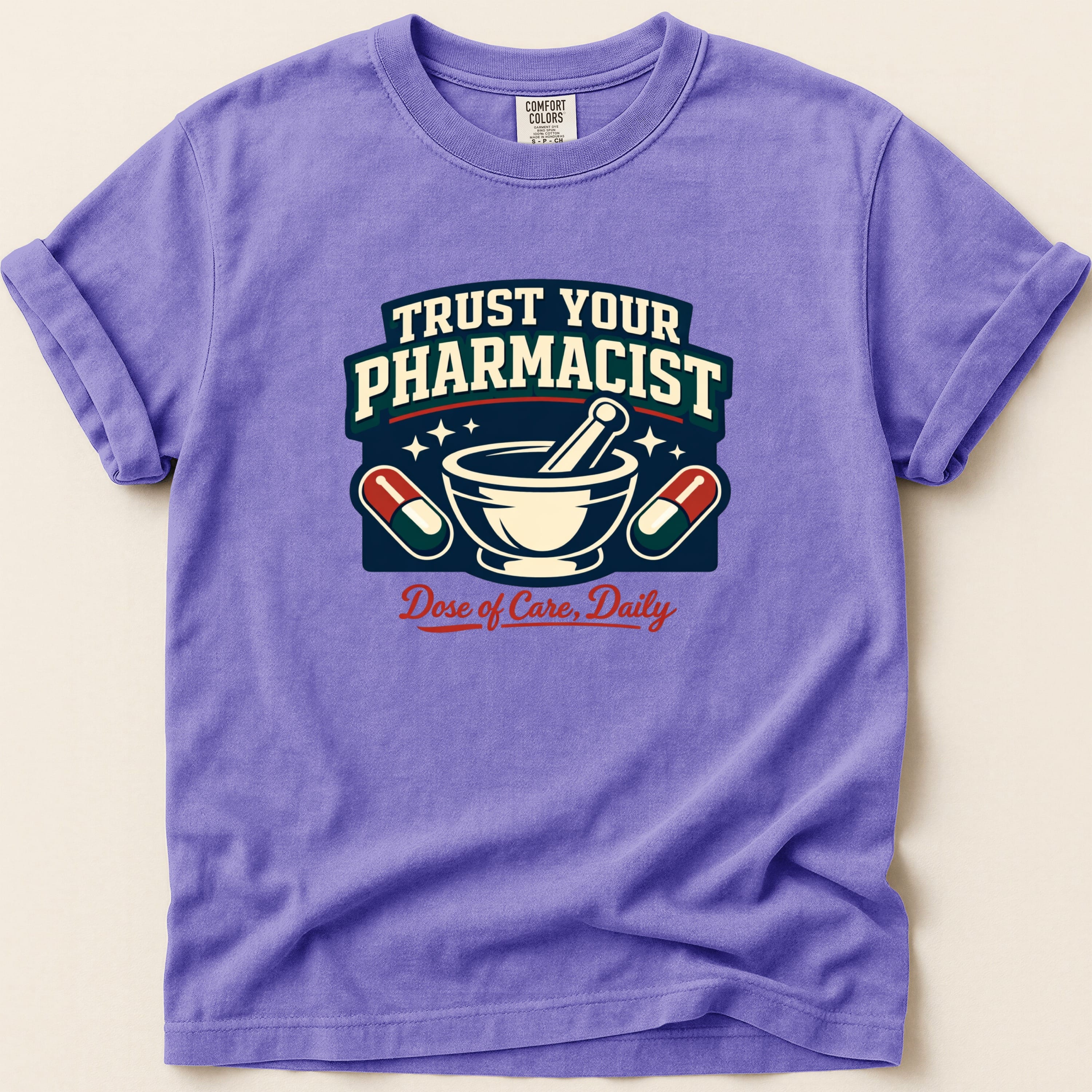 Purple t-shirt with "Trust Your Pharmacist" and "Dose of Care, Daily" text.