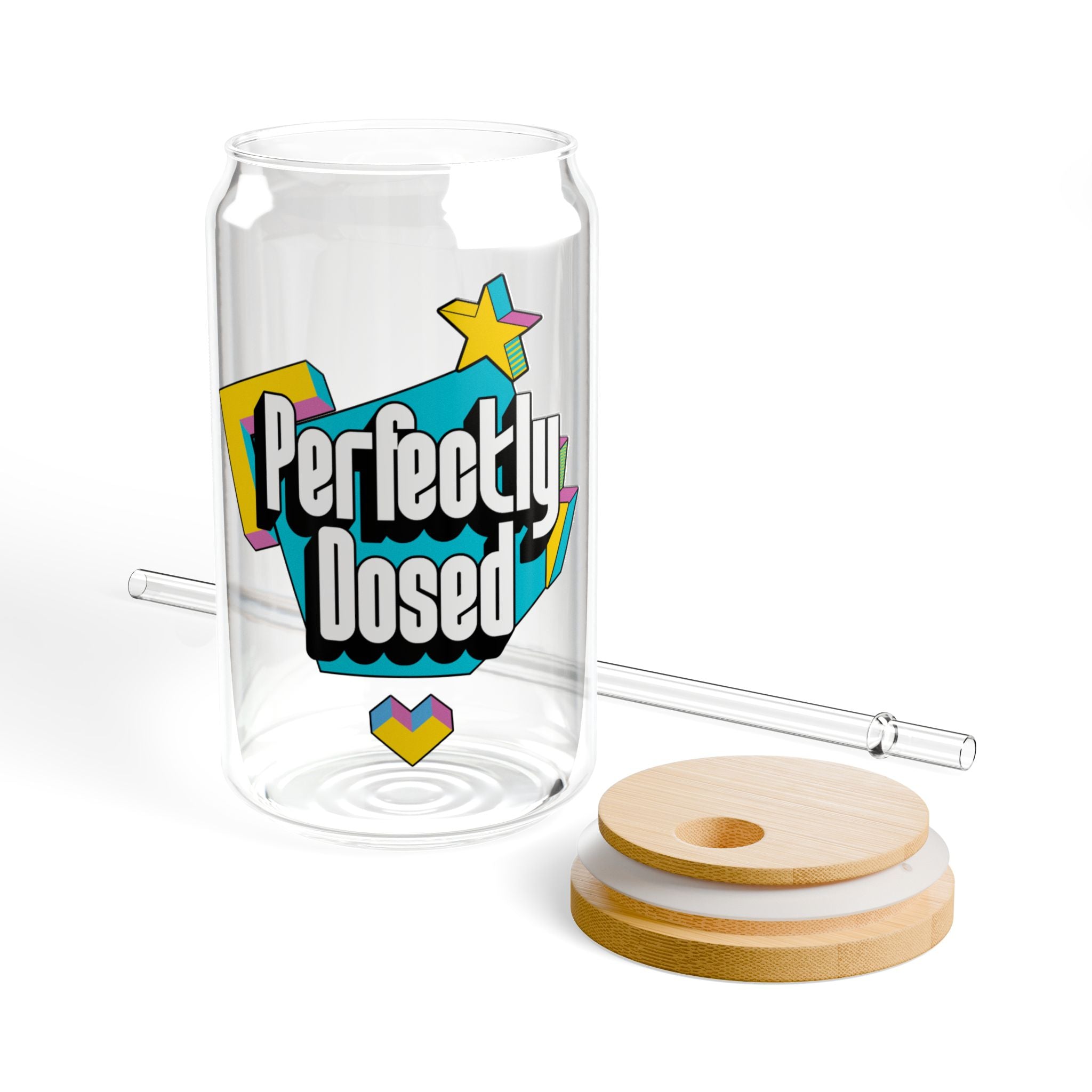 Glass can-shaped cup with "Perfectly Dosed" graphic and glass straw.
