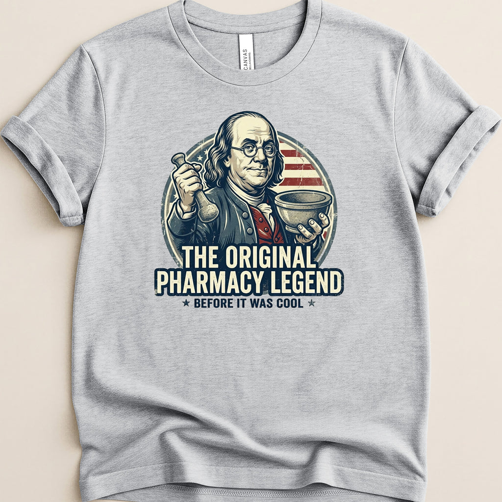 T-shirt graphic: Benjamin Franklin holding pharmacy tools, "The Original Pharmacy Legend".