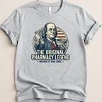 T-shirt graphic: Benjamin Franklin holding pharmacy tools, "The Original Pharmacy Legend".