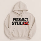 Beige hoodie with "PHARMACY STUDENT" text, the "T" in Student is crossed out.