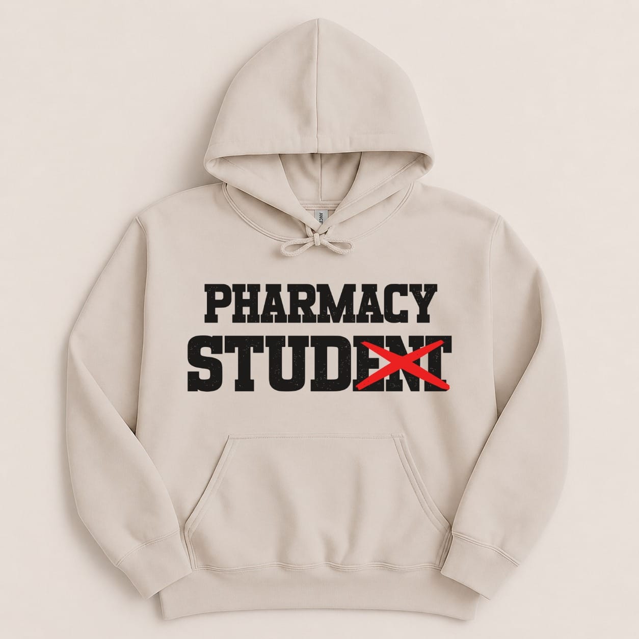 Beige hoodie with "PHARMACY STUDENT" text, the "T" in Student is crossed out.