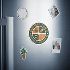Round sticker with text "Caffeine, Chaos, Controlled Substances" and icons on a refrigerator.