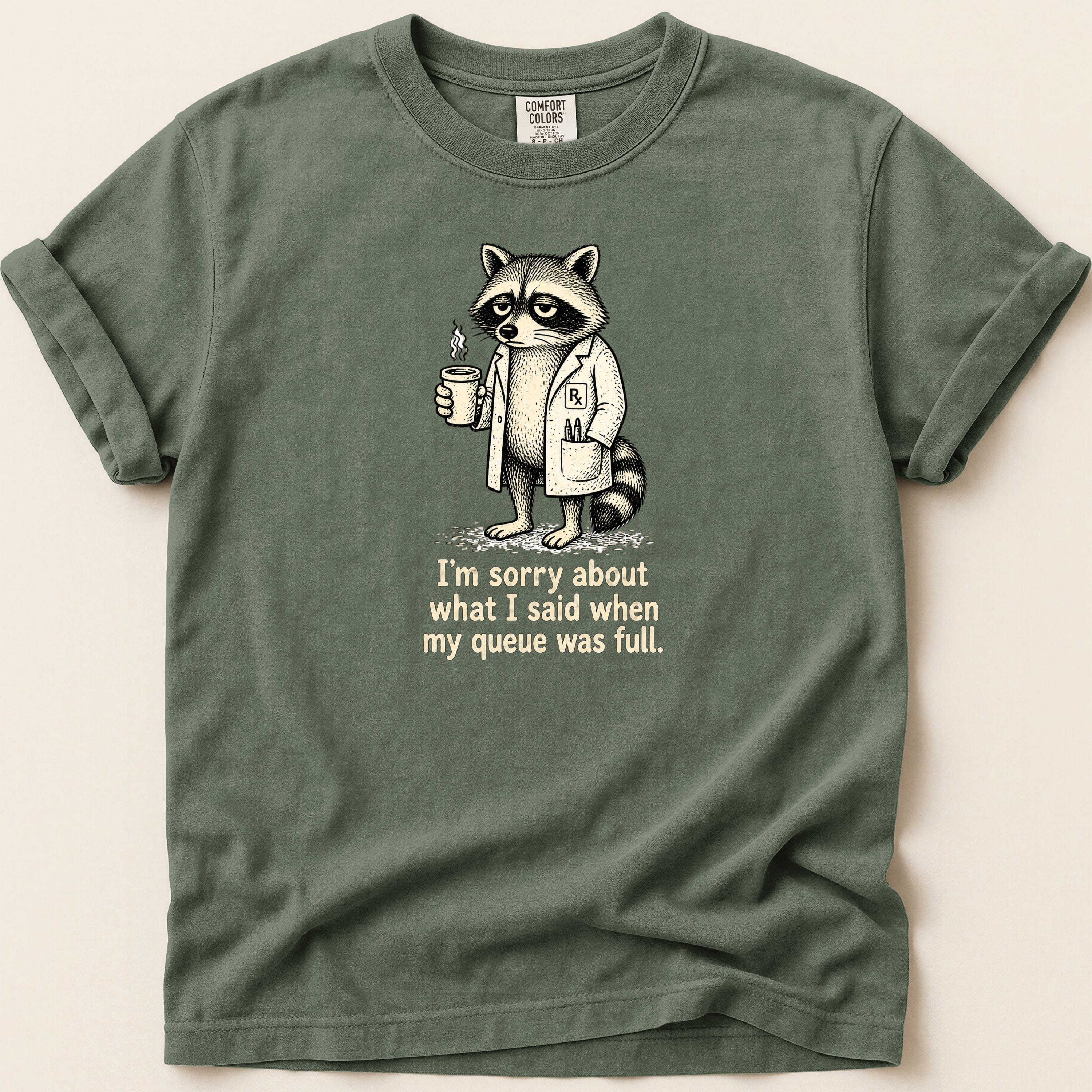 T-shirt with raccoon in lab coat holding coffee, text reads "I'm sorry about what I said when my queue was full."