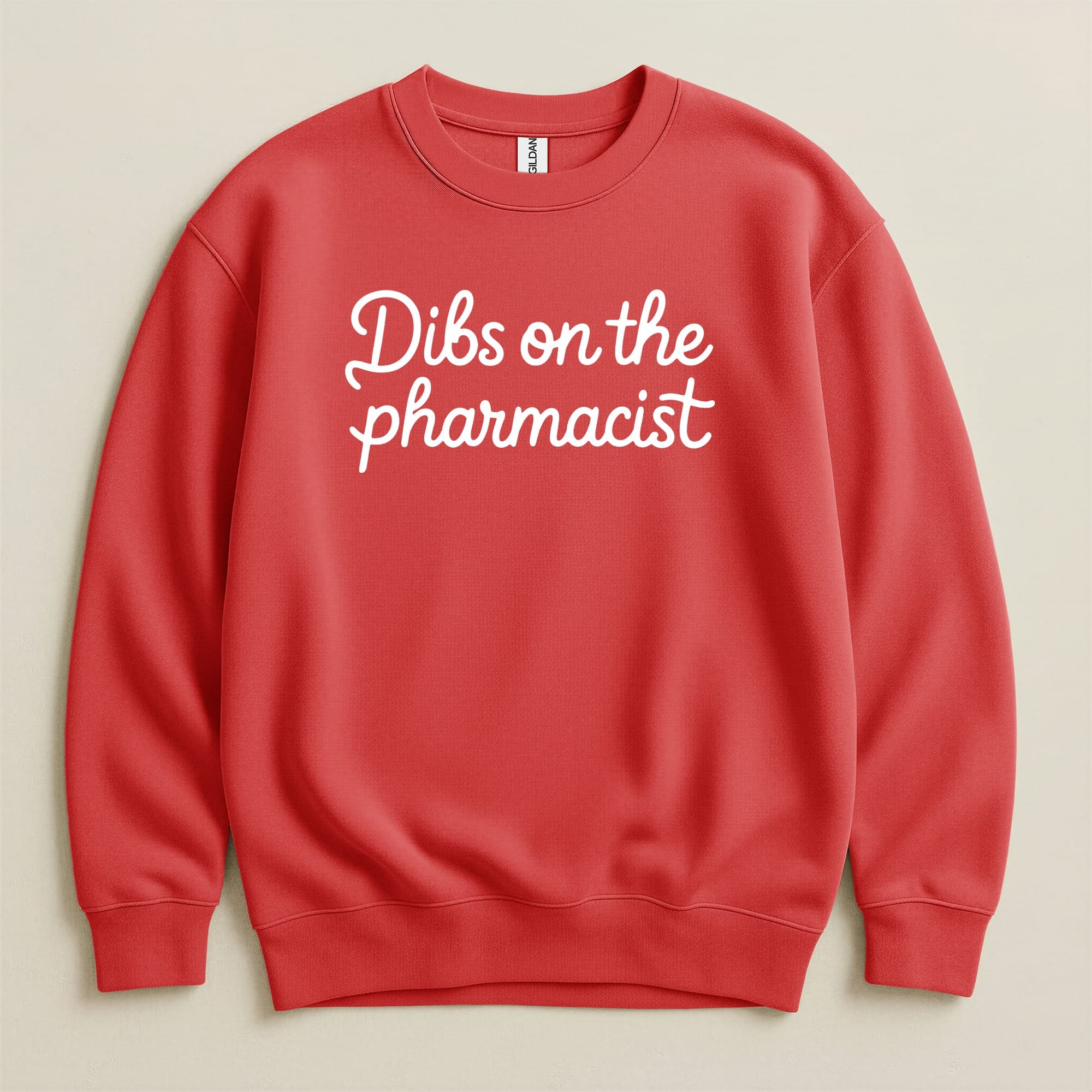 Red sweatshirt with "Dibs on the pharmacist" text in white cursive.