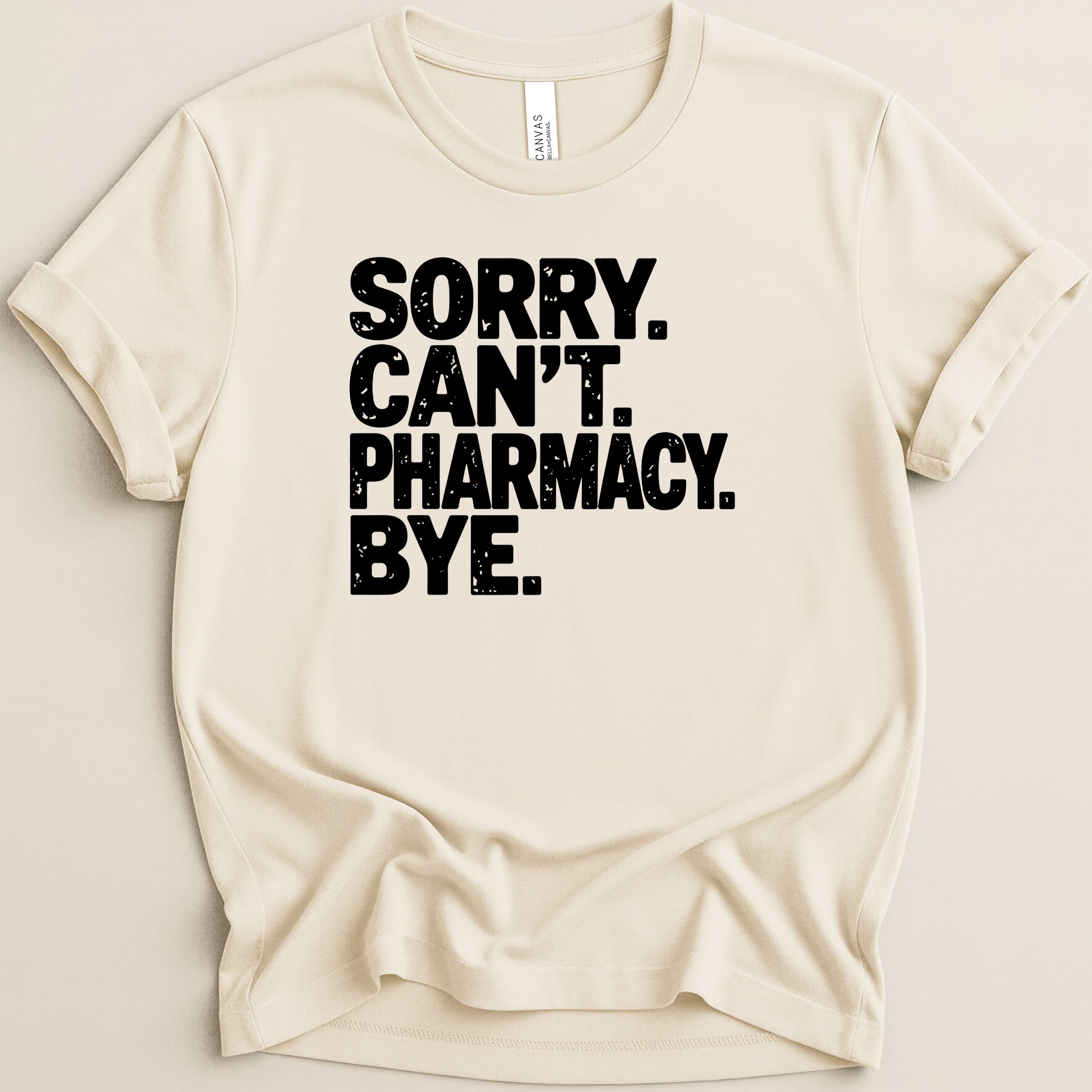 Cream t-shirt with black text: "SORRY. CAN'T. PHARMACY. BYE."