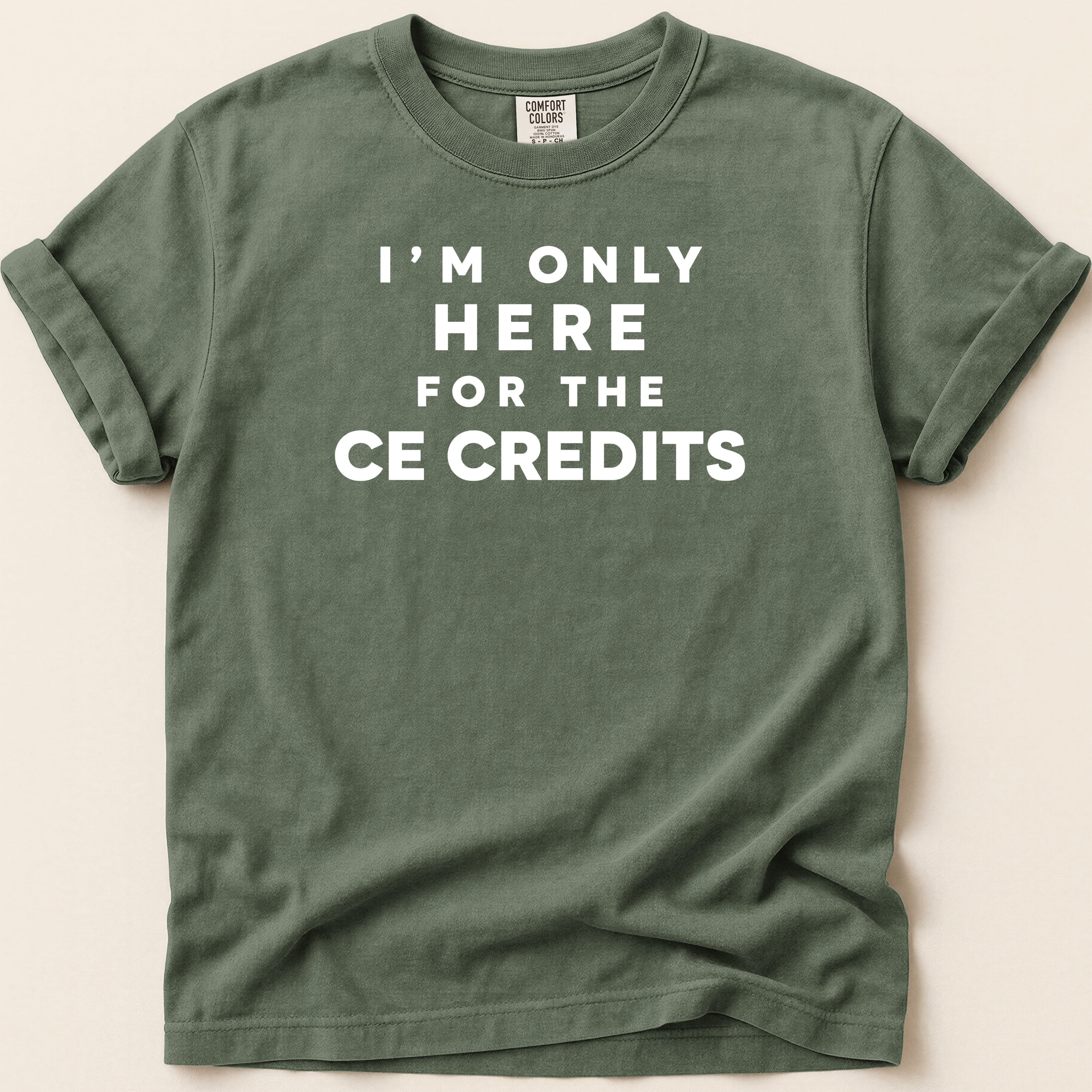 Green t-shirt with white text "I'M ONLY HERE FOR THE CE CREDITS".