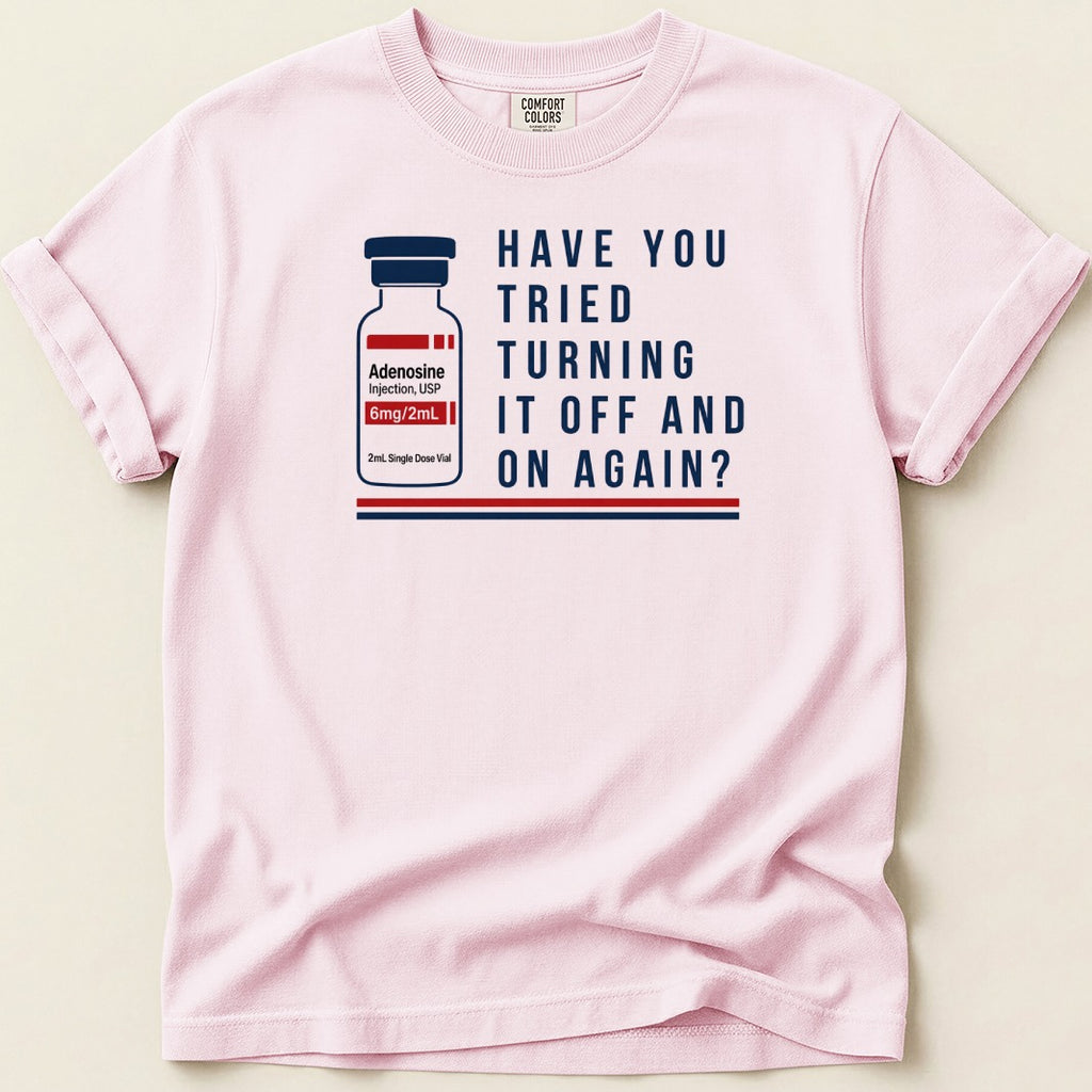 Pink graphic t-shirt with adenosine vial and "Have you tried turning it off and on again?"