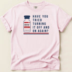 Pink graphic t-shirt with adenosine vial and "Have you tried turning it off and on again?"