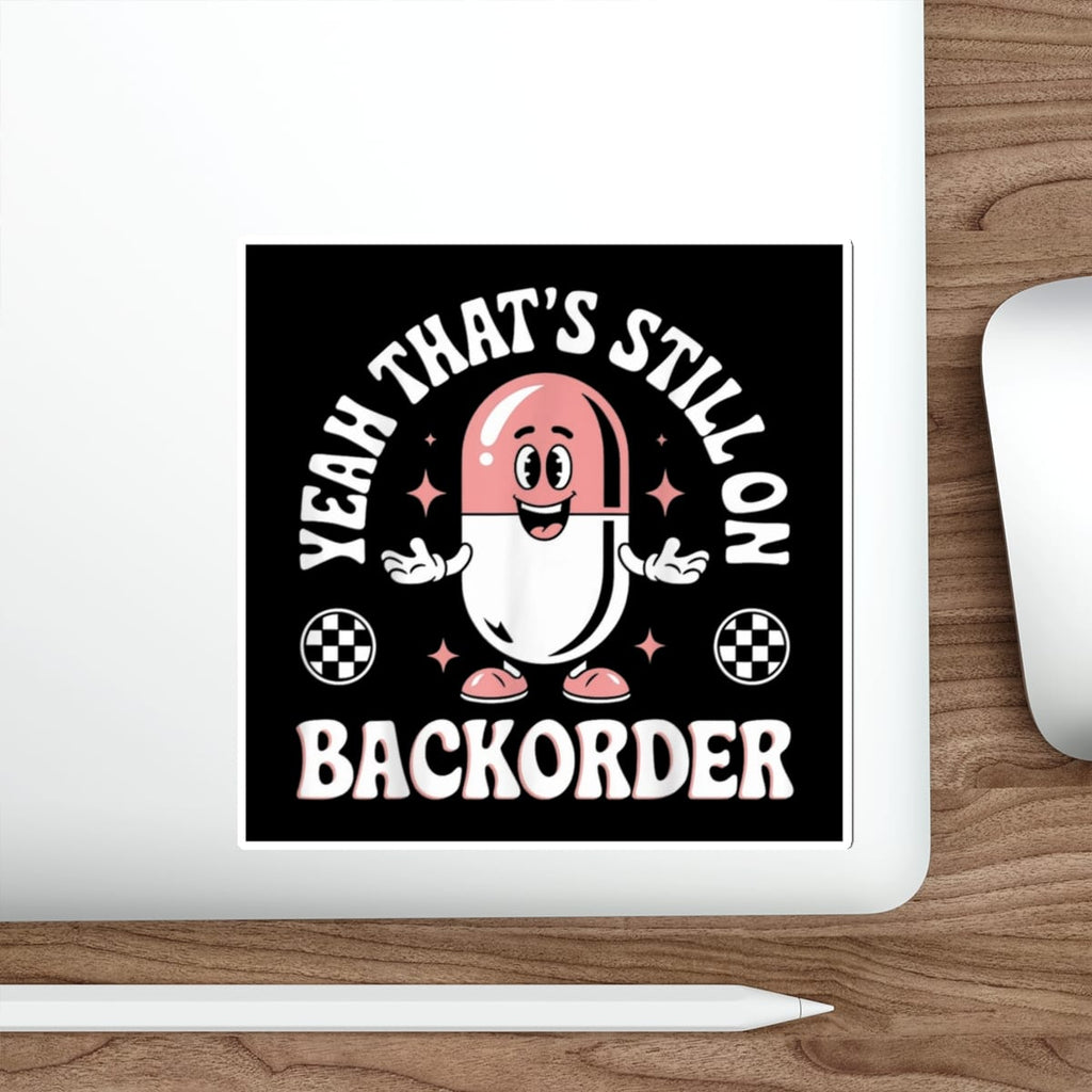 Cartoon capsule character with text "YEAH THAT'S STILL ON BACKORDER".