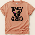 Peach t-shirt with black "DAILY RX GRIND" graphic featuring mortar and pestle.