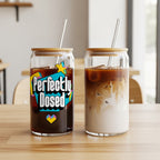 Two can-shaped glasses with straws, one with coffee and text, the other with latte art.