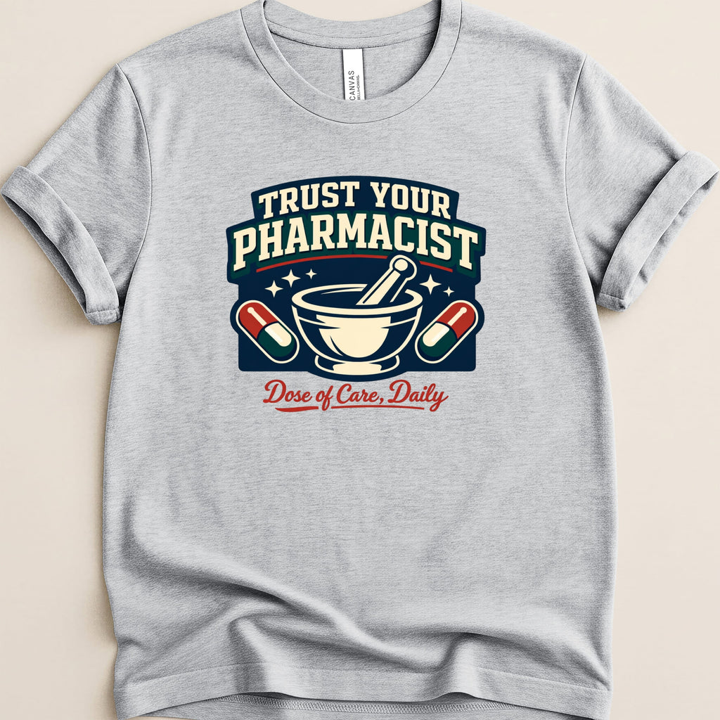 Gray t-shirt with "Trust Your Pharmacist" and "Dose of Care, Daily" text and graphics.