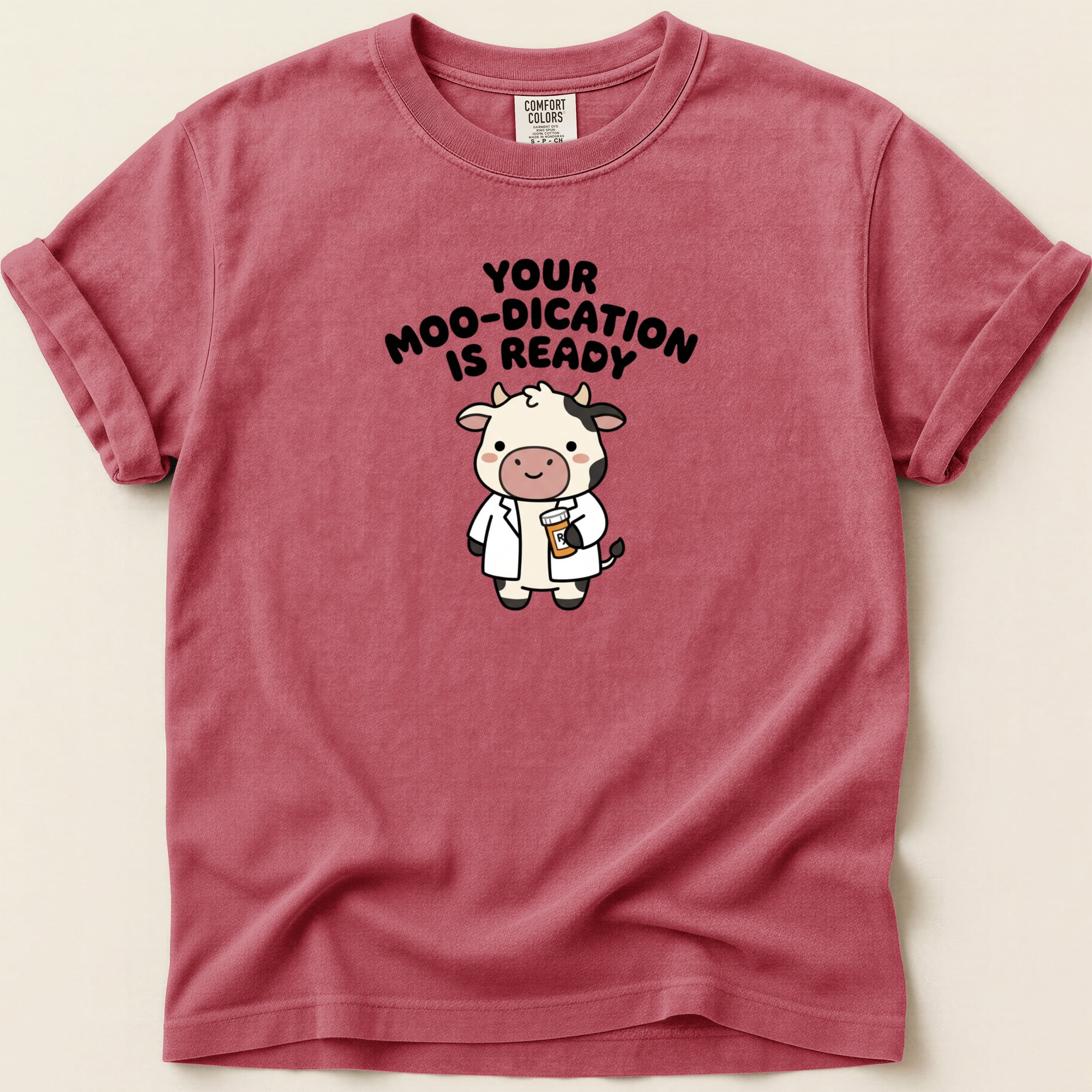 Cartoon cow in lab coat with text "Your moo-dication is ready."