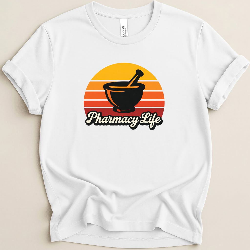 White t-shirt with "Pharmacy Life" text and a mortar and pestle in a sunset graphic.